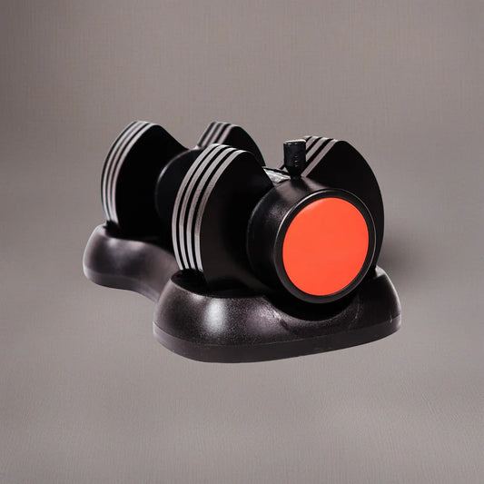 Black and red dumbbell-shaped object on a gray background