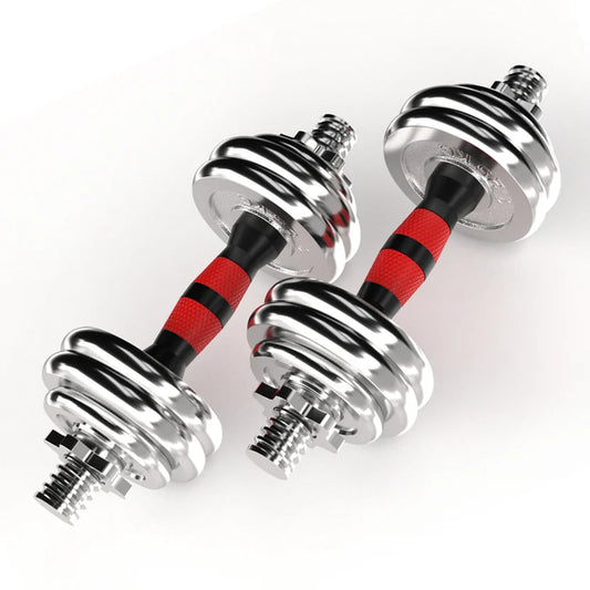 Pair of chrome dumbbells with red and black resistance bands on a white background