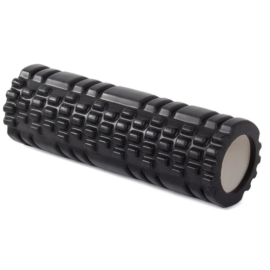 Black foam roller with textured surface on a white background